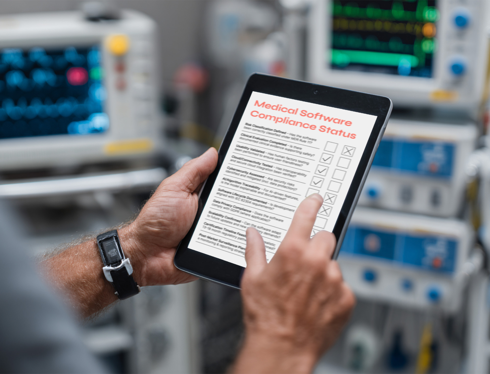 "Engineer reviewing compliance checklist on tablet in clinical environment highlights key challenges in software development for medical devices, from regulatory documentation to cross-platform traceability"